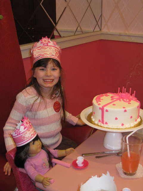 American Girl's signature pink and white cake