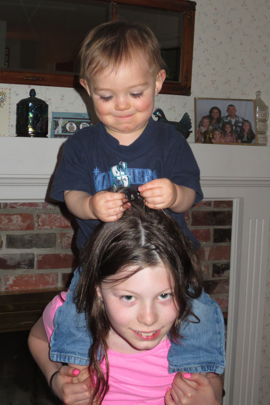 Playing with sister's hair